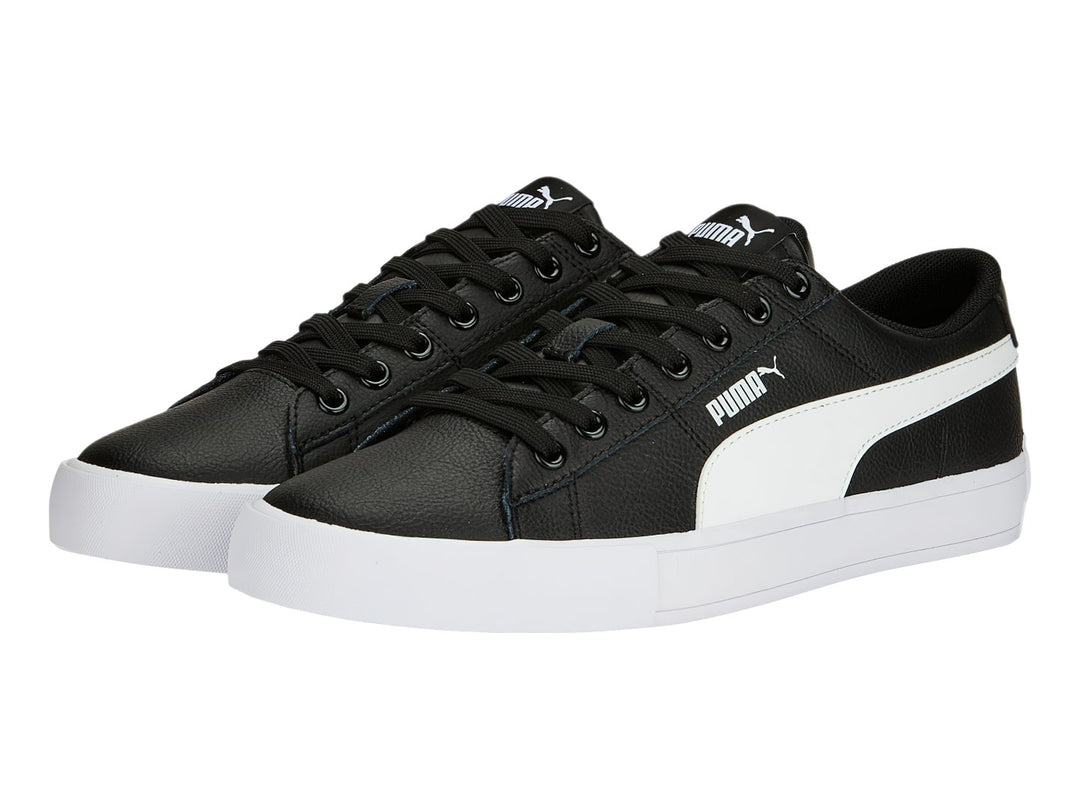 Tenis PUMA BARI CASUAL color negro con franja lateral y suela blanca.