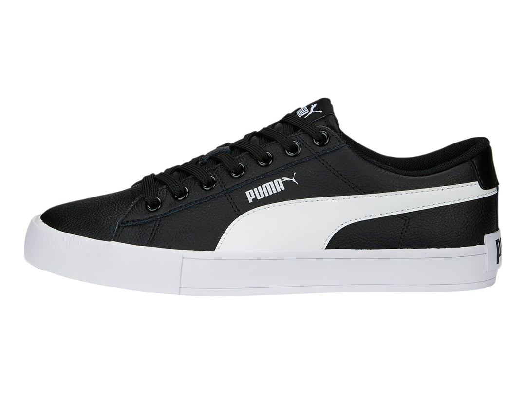 Tenis PUMA BARI CASUAL color negro con franja lateral y suela blanca.