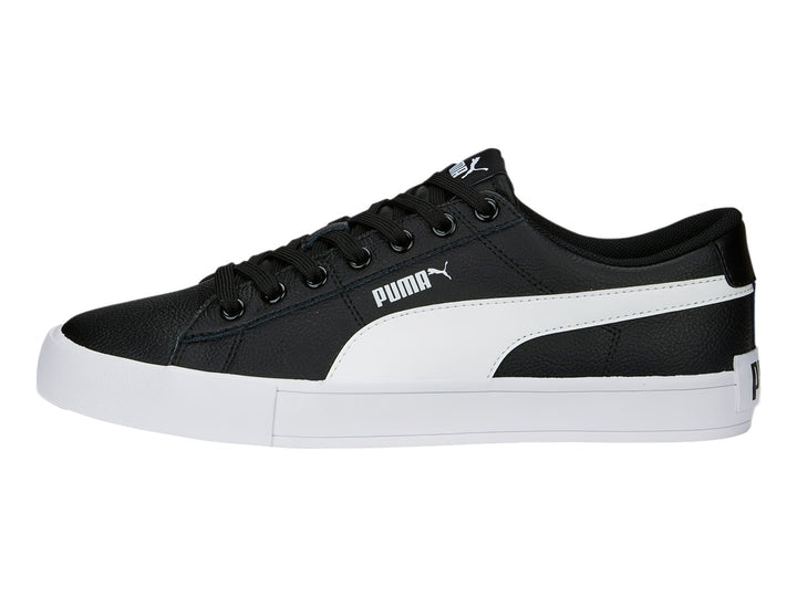 Tenis PUMA BARI CASUAL color negro con franja lateral y suela blanca.