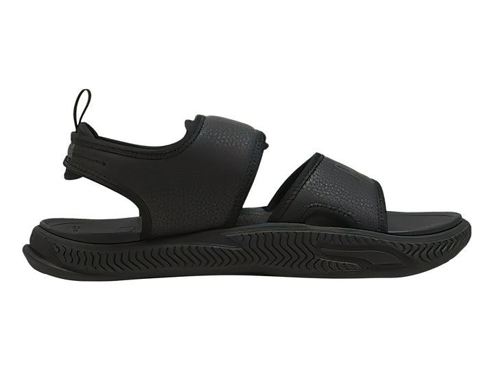 Sandalia deportiva PUMA SoftridePro en color negro total con correa trasera y suela texturizada.