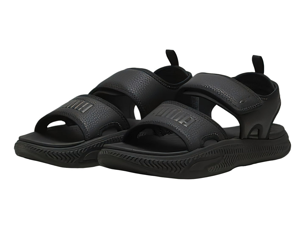 Sandalia deportiva PUMA SoftridePro en color negro total con correa trasera y suela texturizada.