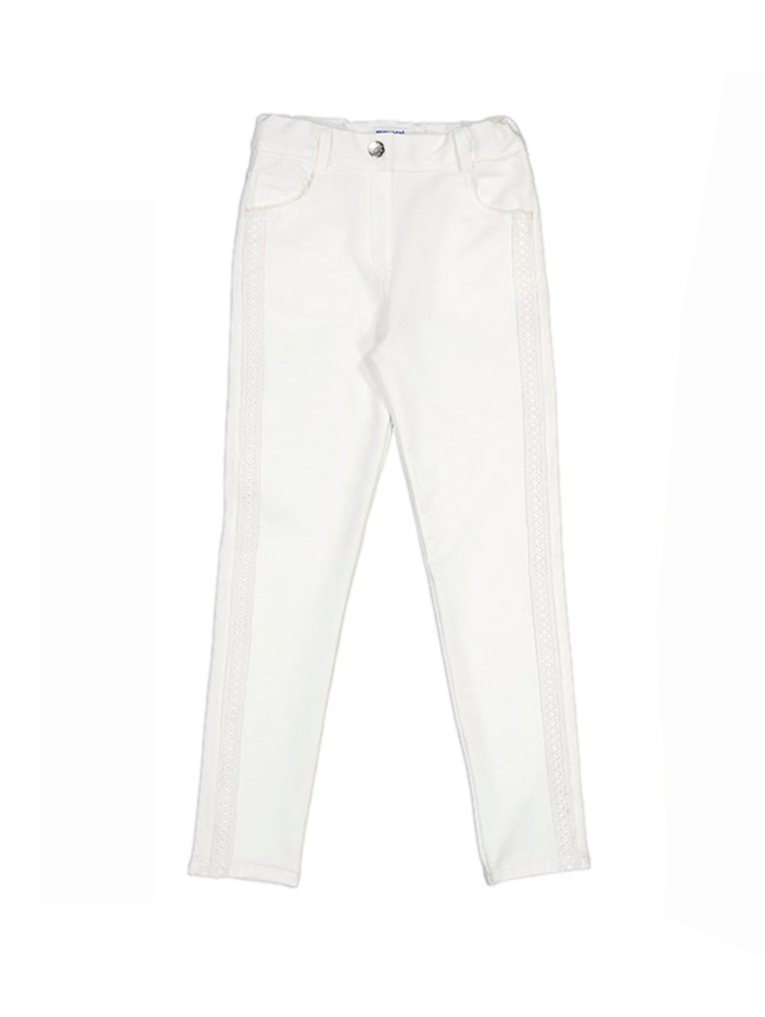Pantalón color crudo para niña con detalles decorativos laterales.