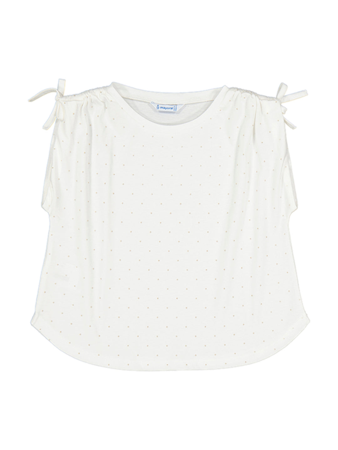Camiseta color crudo para niña con estampado de pequeños topos y lazos decorativos en los hombros.