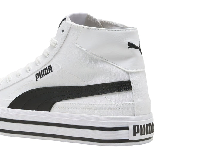 Tenis PUMA blancos de caña alta con franjas negras en la suela.