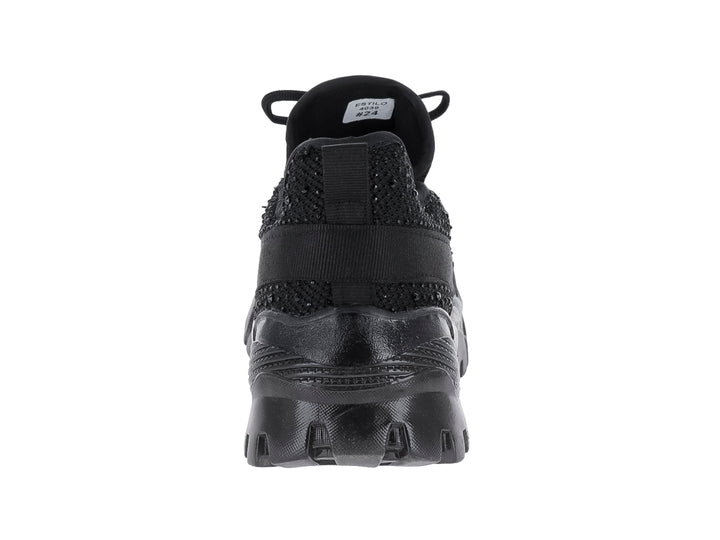 Tenis deportivo negro Andrax con suela gruesa y tejido de malla.