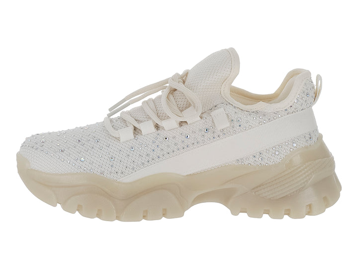 Tenis color beige con suela chunky y detalles de brillantes en la parte superior.