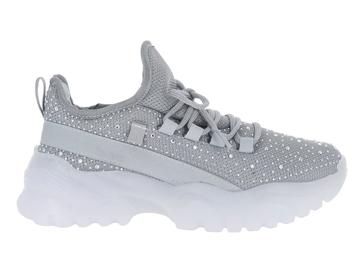 Tenis plateados con detalles brillantes y suela blanca gruesa para niña.