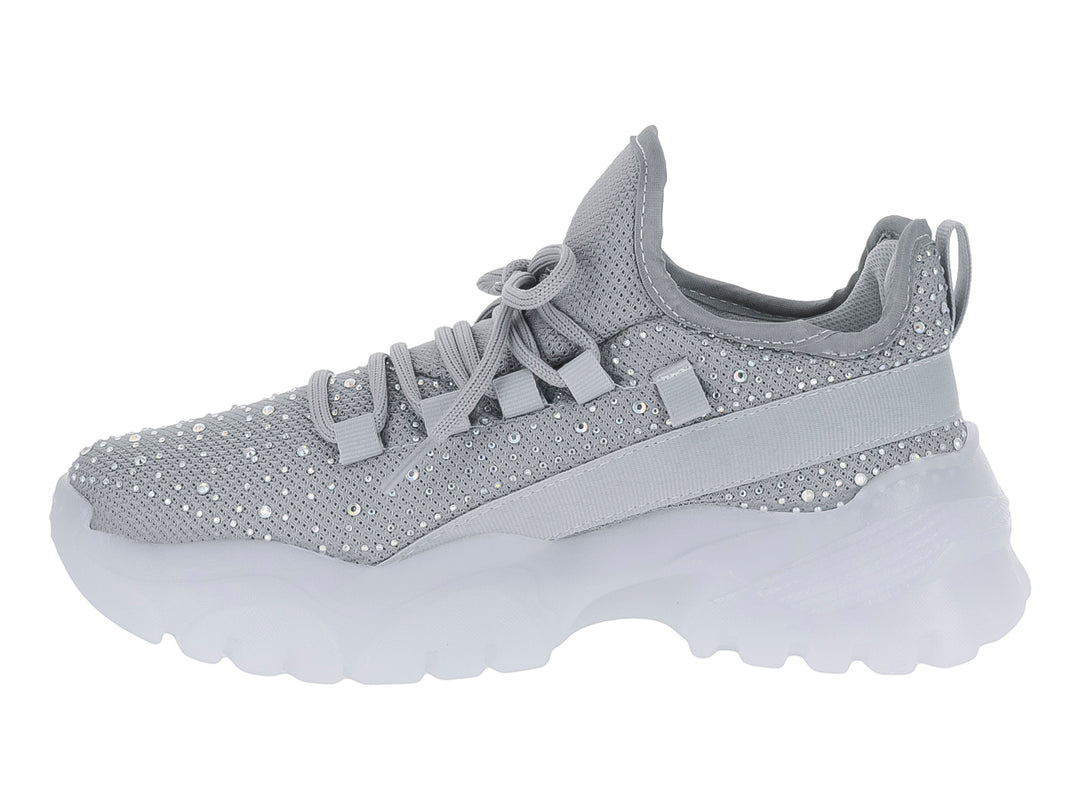 Tenis plateados con detalles brillantes y suela blanca gruesa para niña.