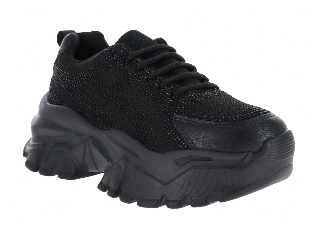 Tenis deportivos color negro con suela gruesa y diseño moderno de la marca Andrax.