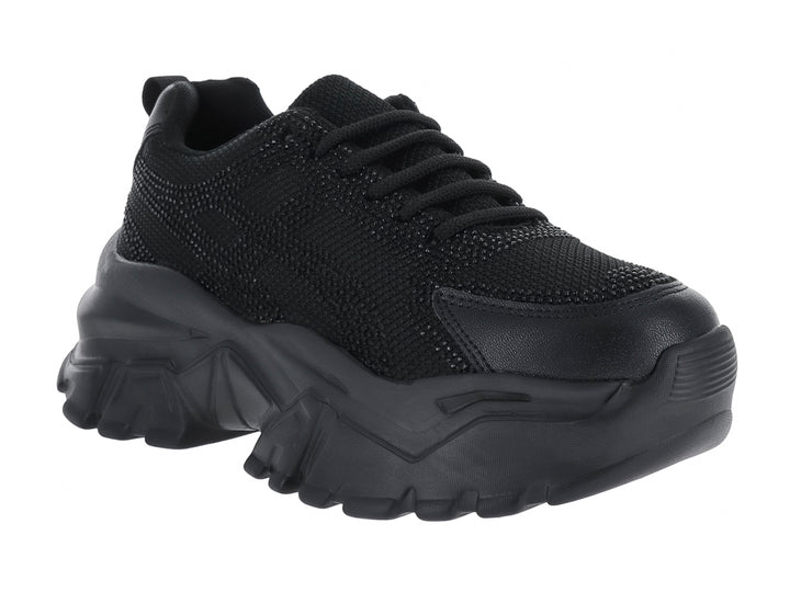 Tenis deportivos color negro con suela gruesa y diseño moderno de la marca Andrax.