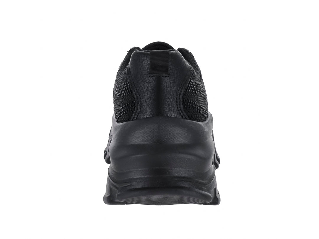 Tenis deportivos color negro con suela gruesa y diseño moderno de la marca Andrax.
