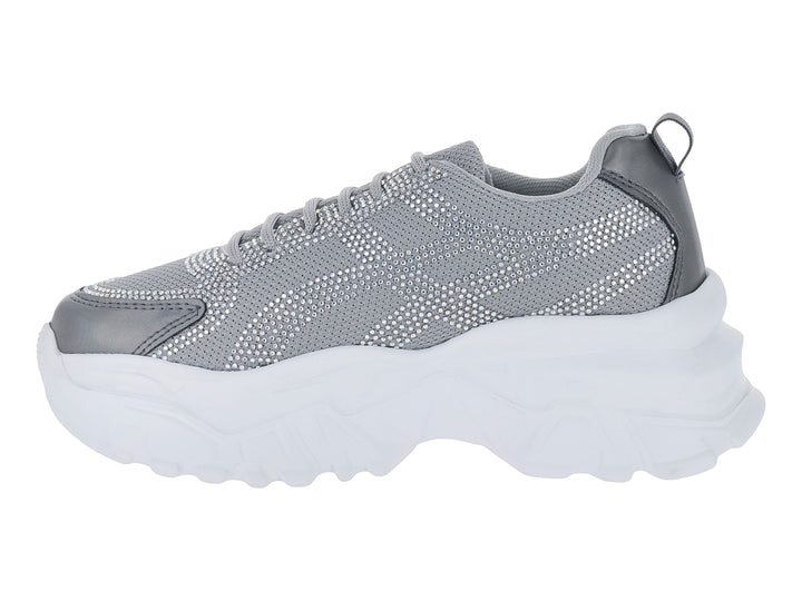 Tenis deportivos color gris con suela blanca gruesa y cordones.