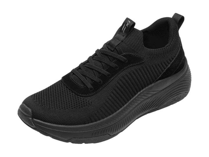 Tenis deportivos Flexi color negro con tejido textil y suela gruesa.