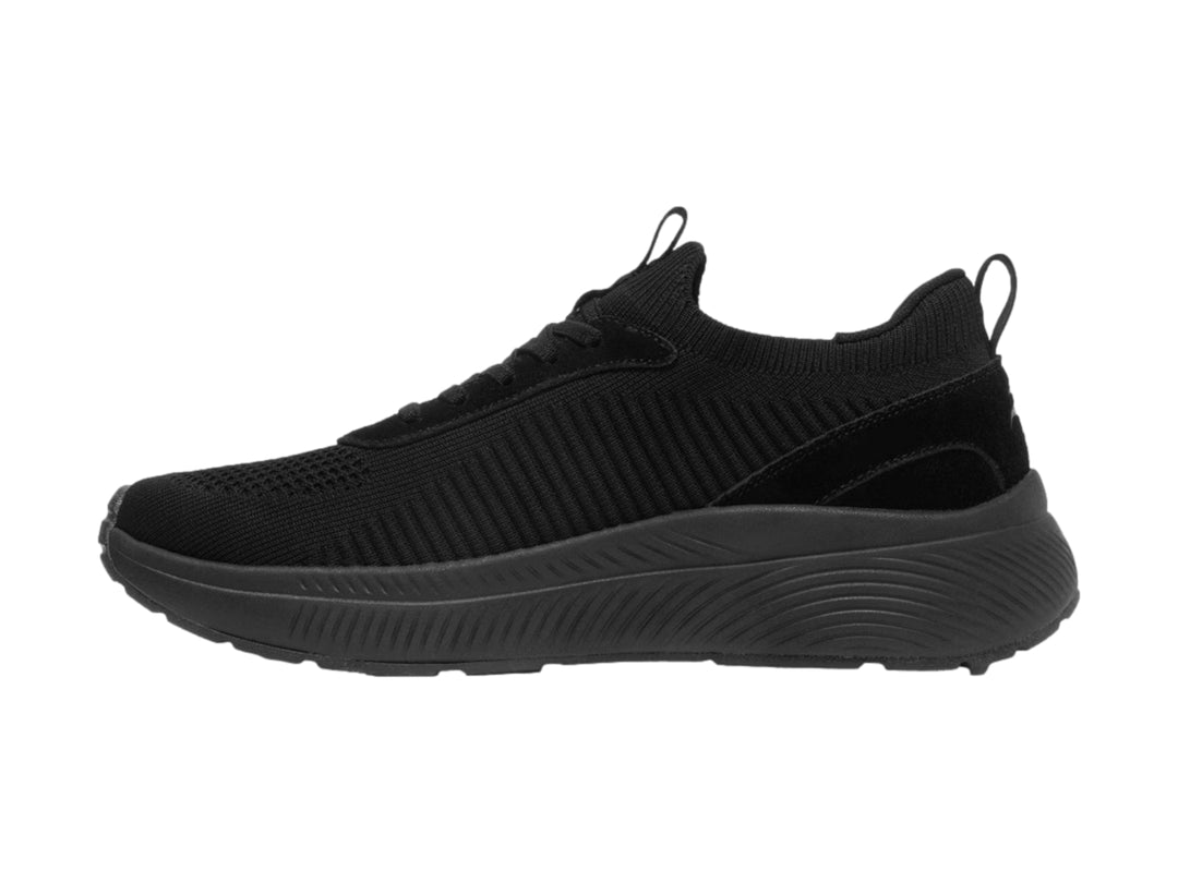 Tenis deportivos Flexi color negro con tejido textil y suela gruesa.