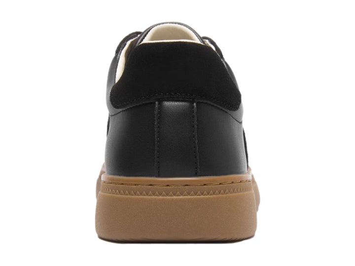 Tenis casuales Flexi color negro con suela color café y detalles en gamuza sintética.