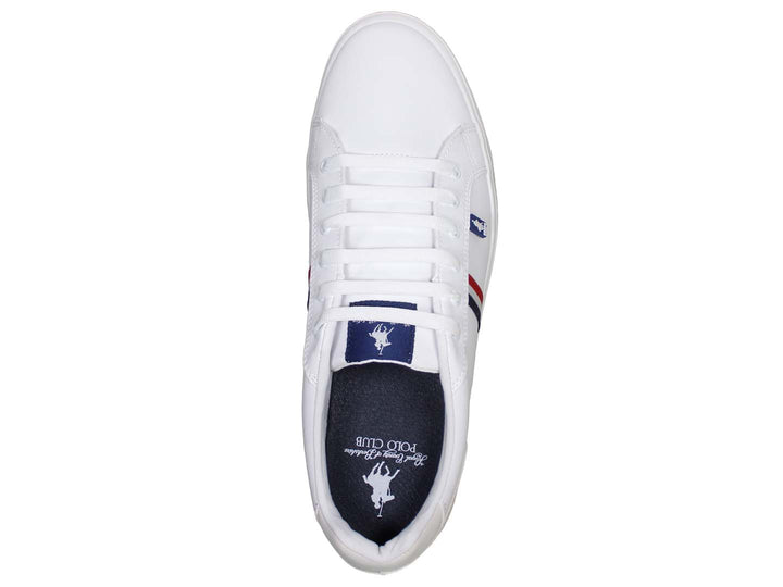 Tenis blancos de The Polo Club con franjas azul y roja en el costado y suela blanca.