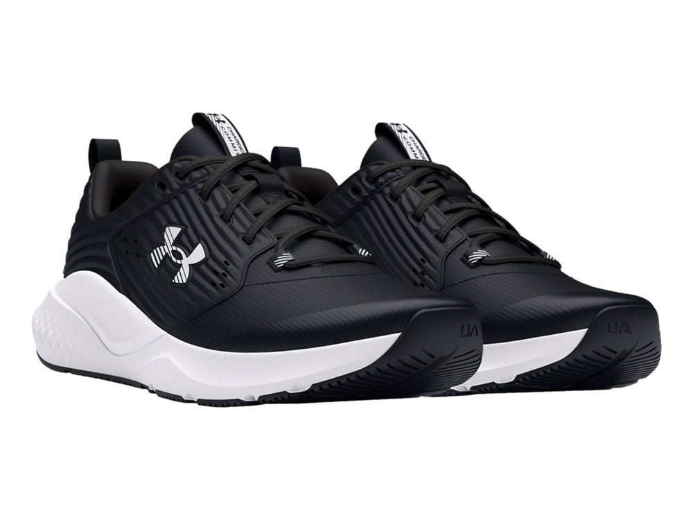Tenis deportivos Under Armour color negro con suela blanca y logotipo blanco.
