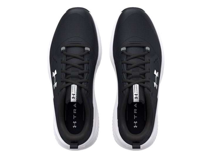 Tenis deportivos Under Armour color negro con suela blanca y logotipo blanco.