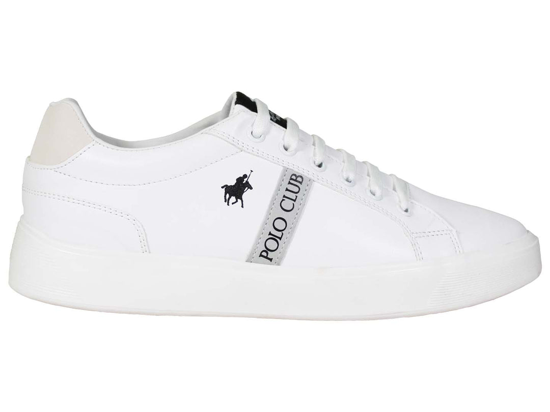 Tenis blancos de The Polo Club con logotipo negro y suela plana.