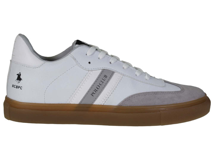 Tenis blancos THE POLO CLUB con suela color café y detalles en gris en la punta.