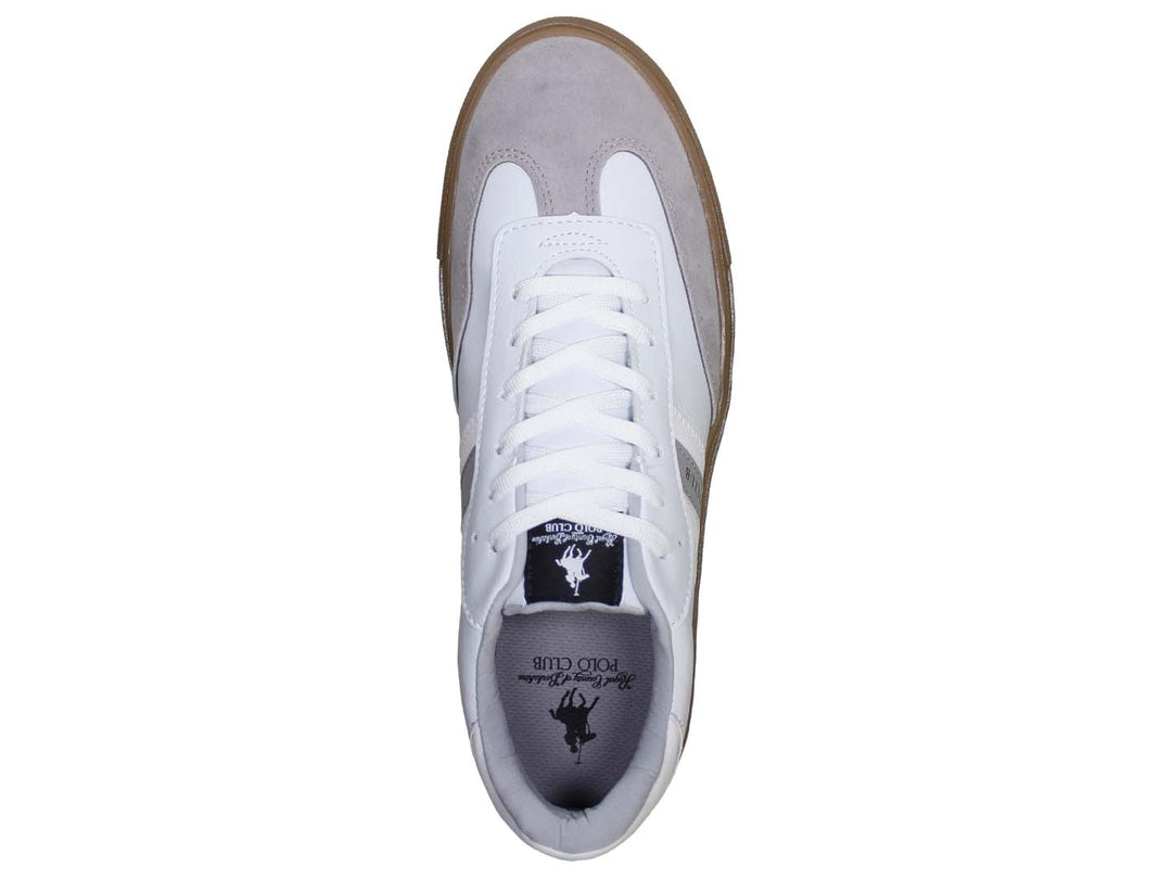 Tenis blancos THE POLO CLUB con suela color café y detalles en gris en la punta.
