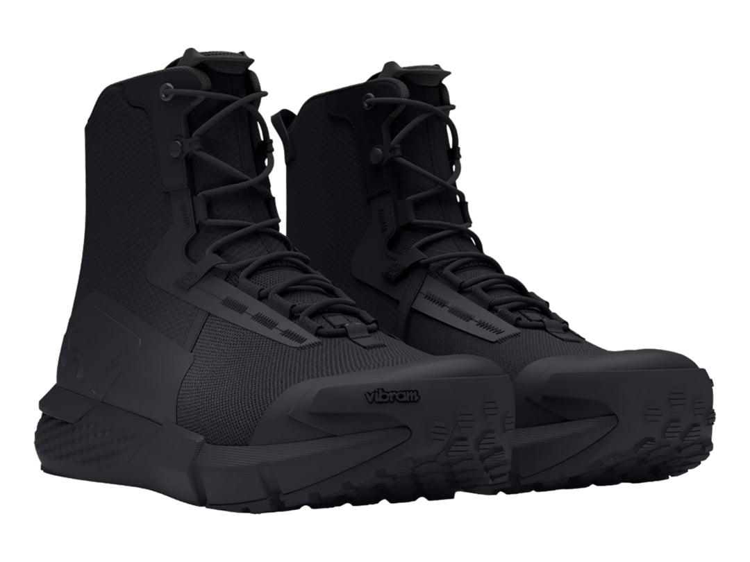 Bota deportiva Under Armour Charged Valsetz en color negro, diseño táctico de caña media con suela gruesa.