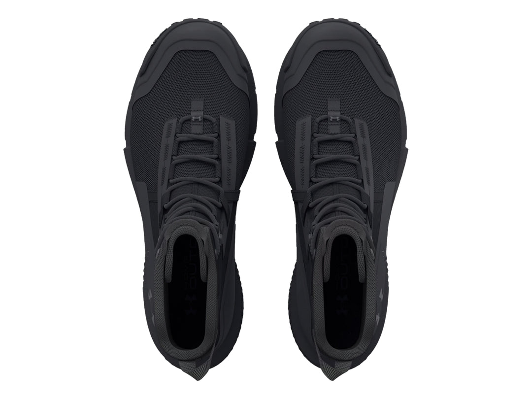 Bota deportiva Under Armour Charged Valsetz en color negro, diseño táctico de caña media con suela gruesa.