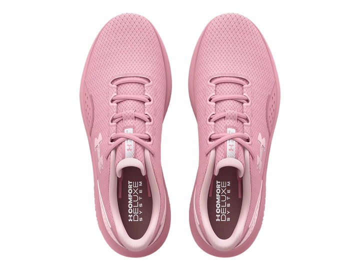 Tenis deportivos Under Armour de color rosa con suela Charged y malla transpirable.