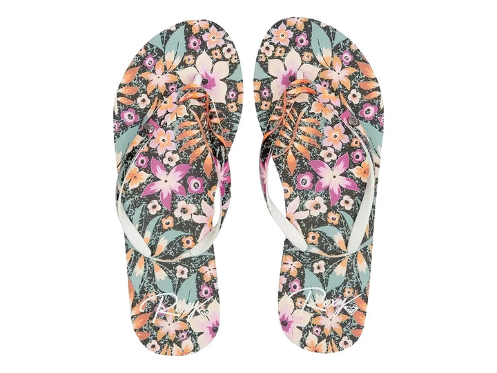 Sandalias ROXY con estampado floral y suela en capas de colores negro, morado y azul.