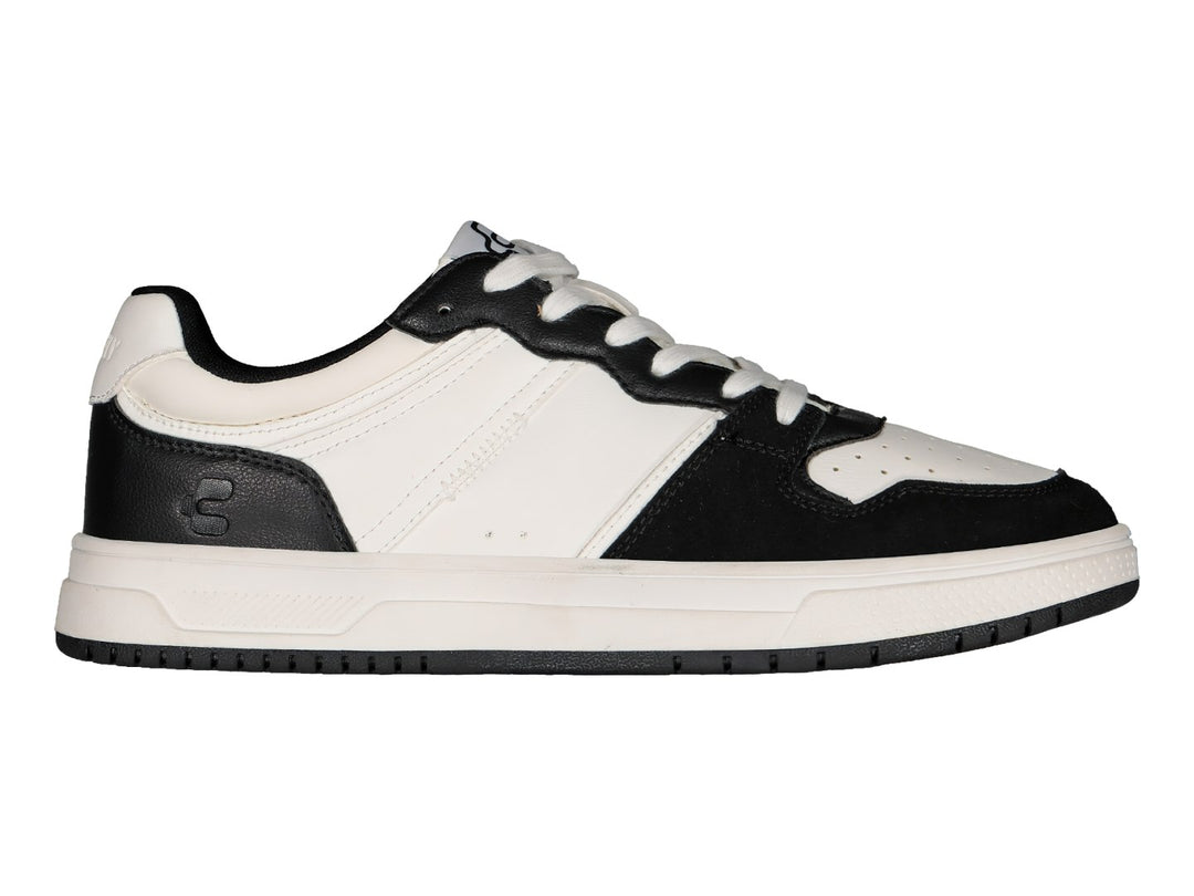Tenis deportivos marca Charly en colores blanco y negro con suela blanca y detalles negros.