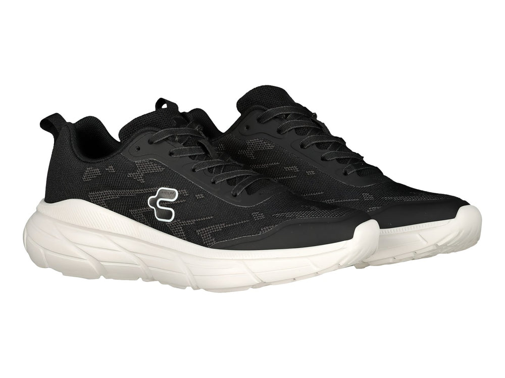 Tenis deportivos Charly color negro con suela blanca.