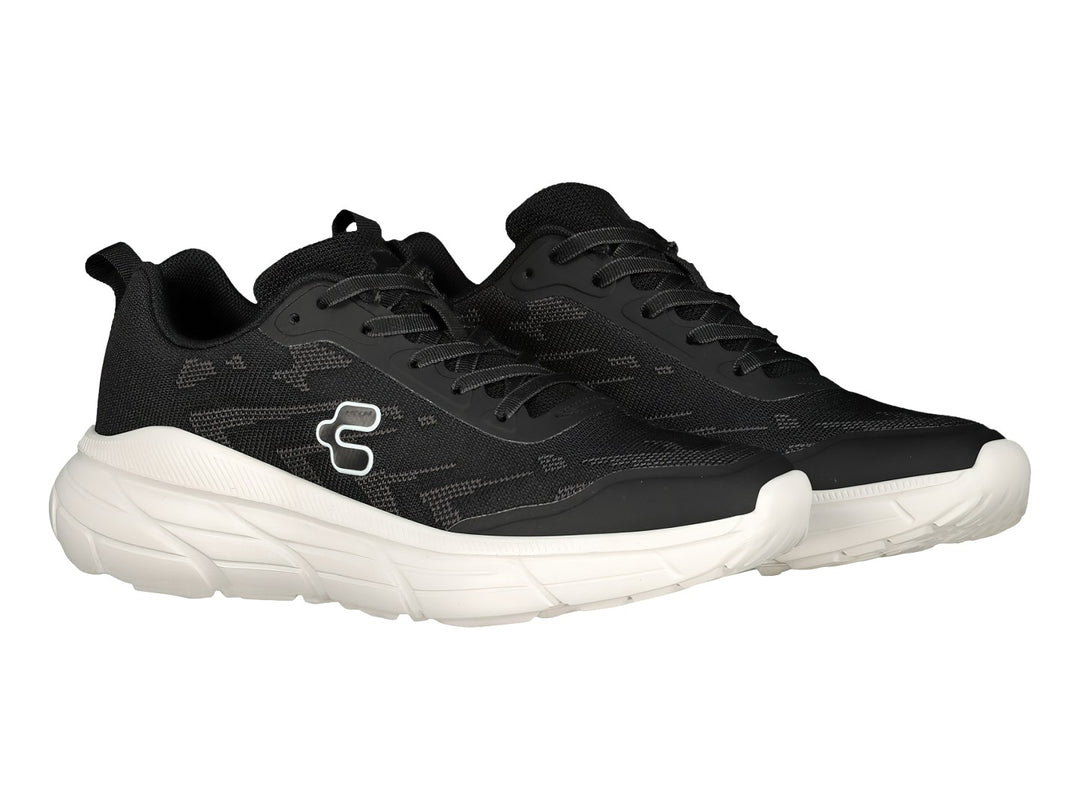 Tenis deportivos Charly color negro con suela blanca.