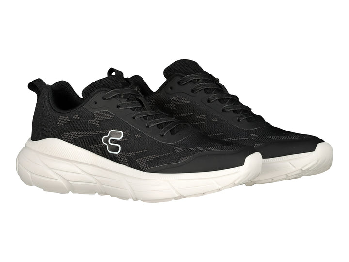 Tenis deportivos Charly color negro con suela blanca.