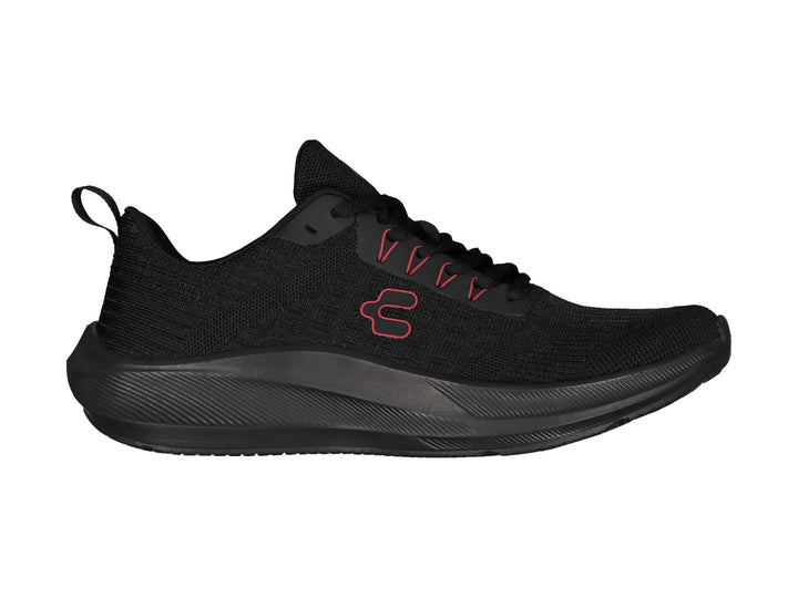 Tenis deportivos Charly color negro con detalles en rojo y suela negra.
