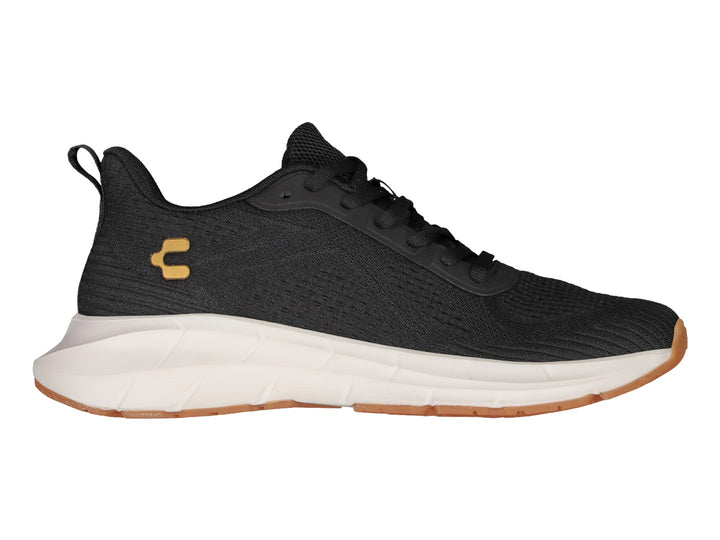 Tenis deportivos Charly color negro con suela blanca y suela exterior color café.
