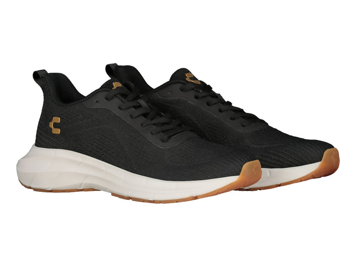 Tenis deportivos Charly color negro con suela blanca y suela exterior color café.