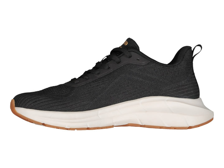 Tenis deportivos Charly color negro con suela blanca y suela exterior color café.