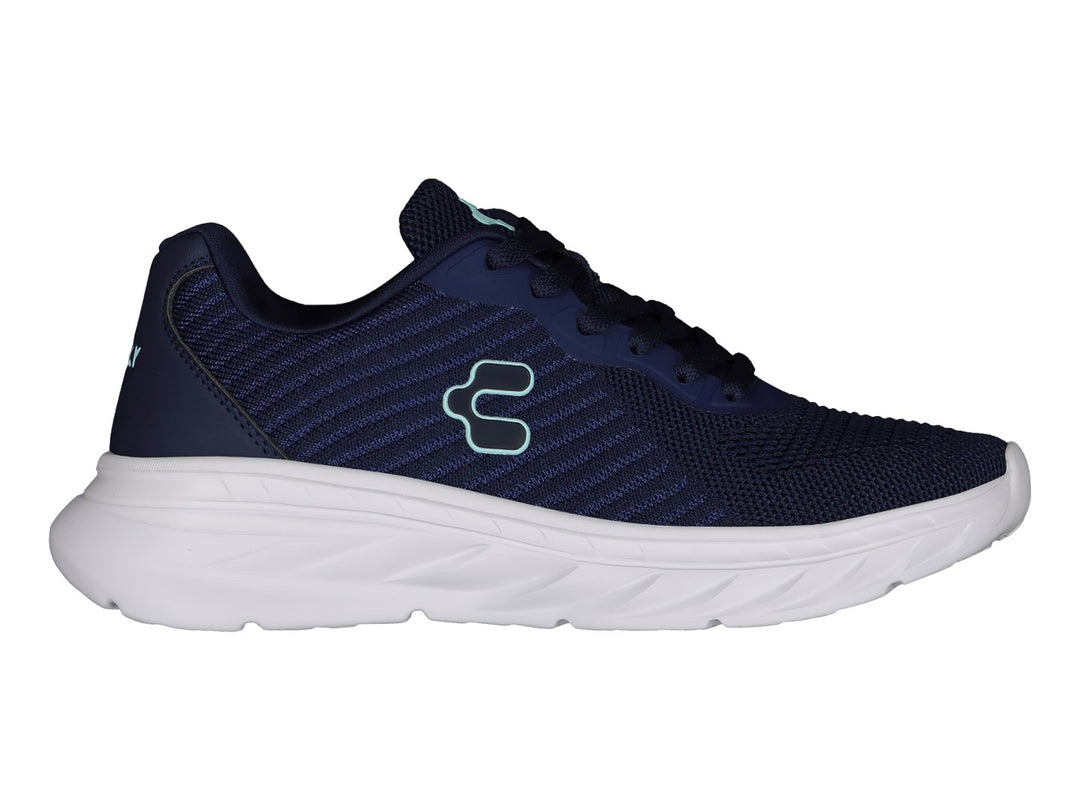 Tenis deportivos Charly en color azul marino con suela blanca y logotipo lateral en tono turquesa.
