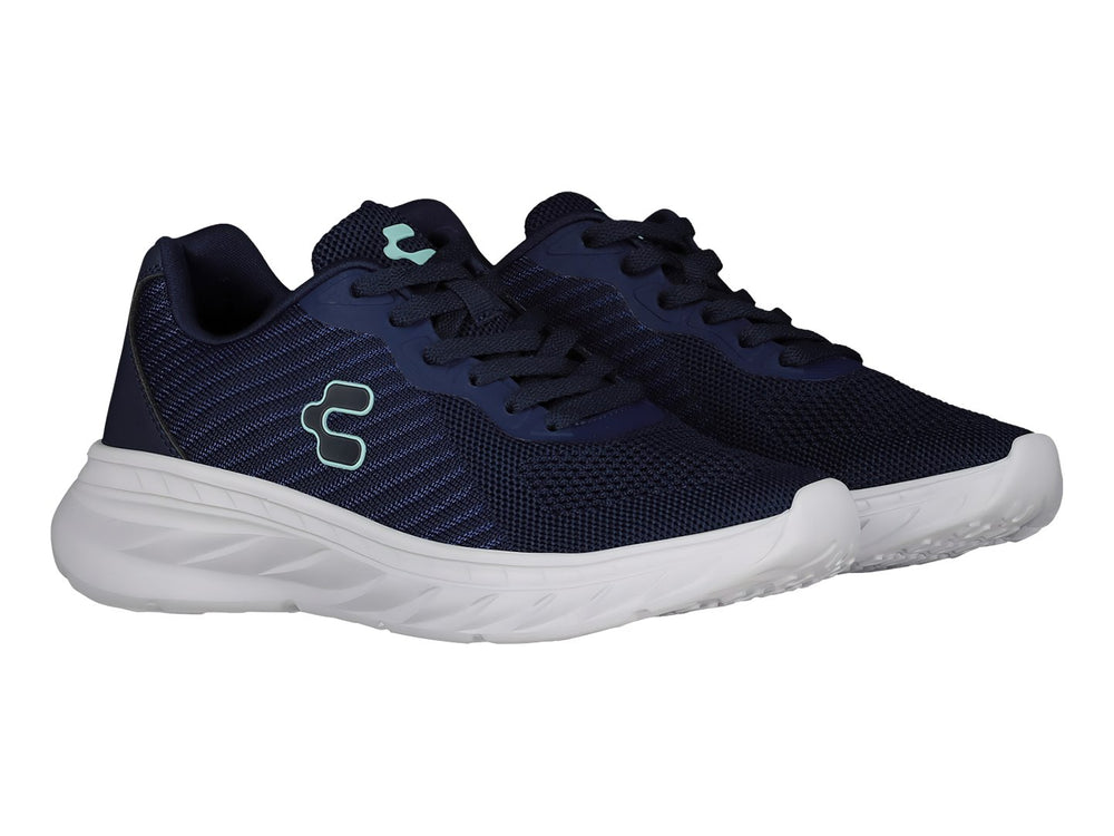 Tenis deportivos Charly en color azul marino con suela blanca y logotipo lateral en tono turquesa.