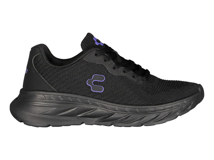 Tenis deportivos Charly color negro con suela robusta y detalle de logo morado.