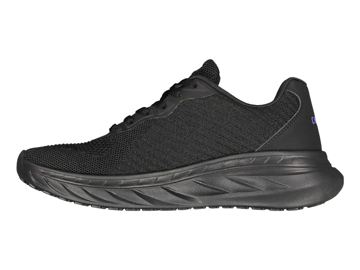 Tenis deportivos Charly color negro con suela robusta y detalle de logo morado.