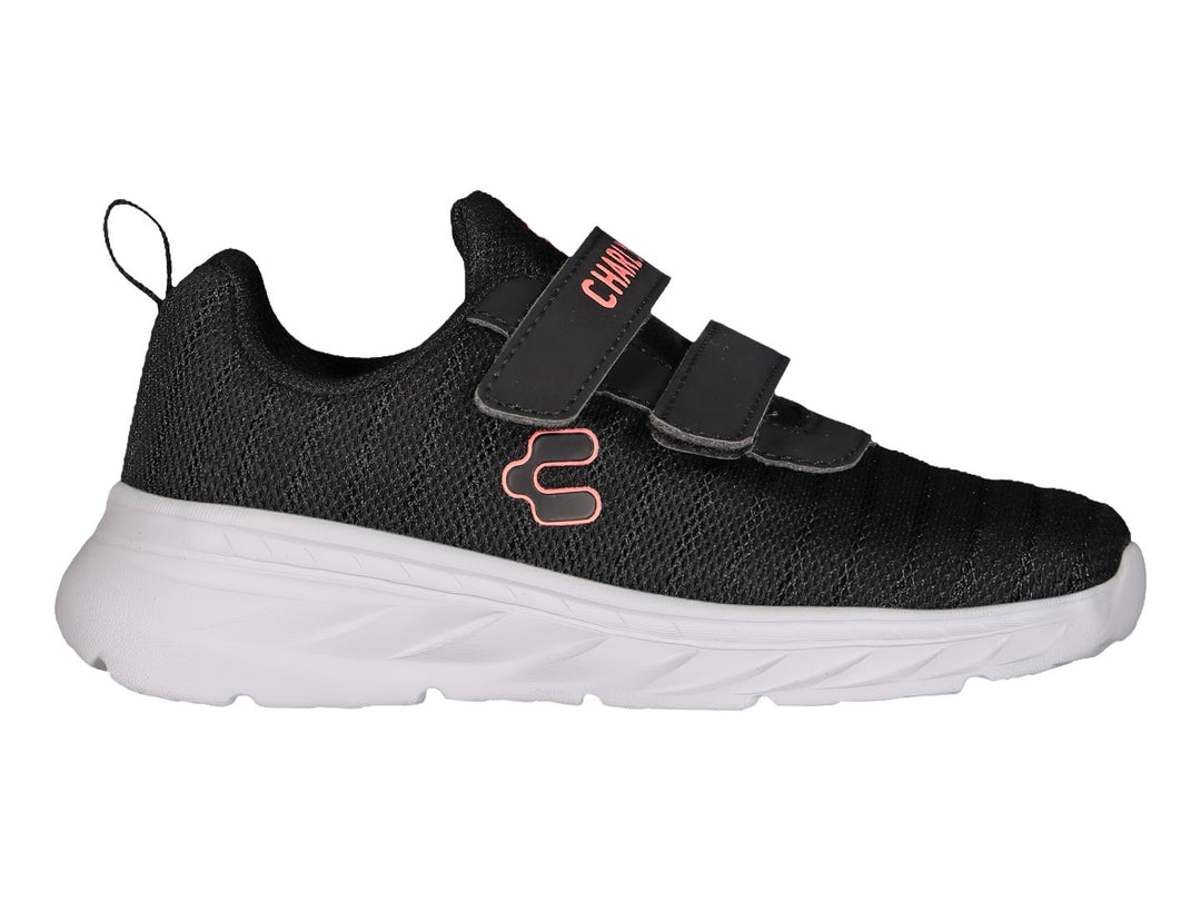 Tenis deportivos Charly color negro con suela blanca y cierre de velcro.