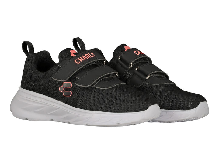Tenis deportivos Charly color negro con suela blanca y cierre de velcro.