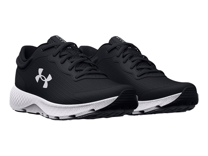 Zapato deportivo Under Armour Charged Escape 4 en color negro con suela blanca para niño.