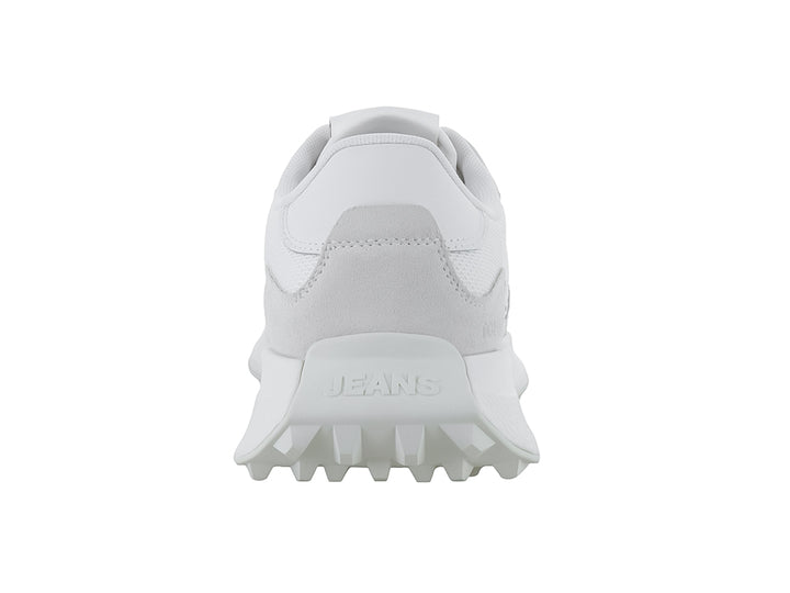 Tenis Tommy Hilfiger modelo Runner Mix Material en color ecru con suela blanca y diseño deportivo.