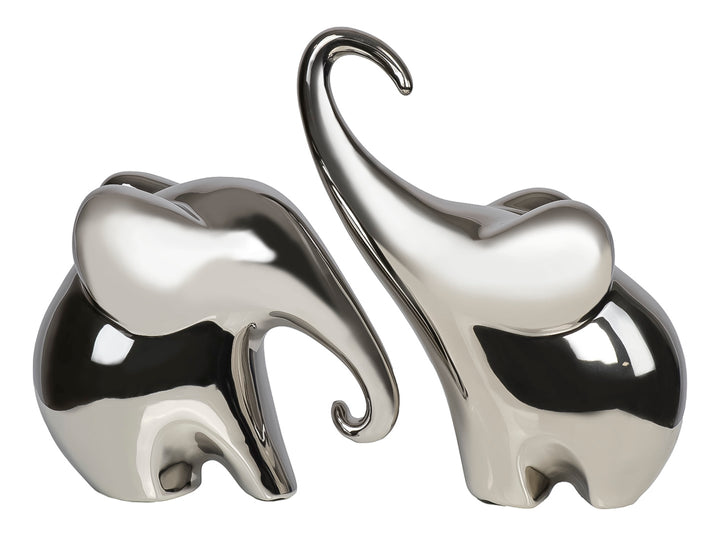 Set de dos figuras decorativas de elefantes en cerámica con acabado brillante color plata.