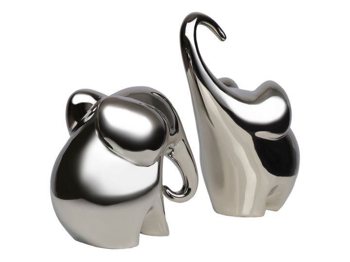 Set de dos figuras decorativas de elefantes en cerámica con acabado brillante color plata.