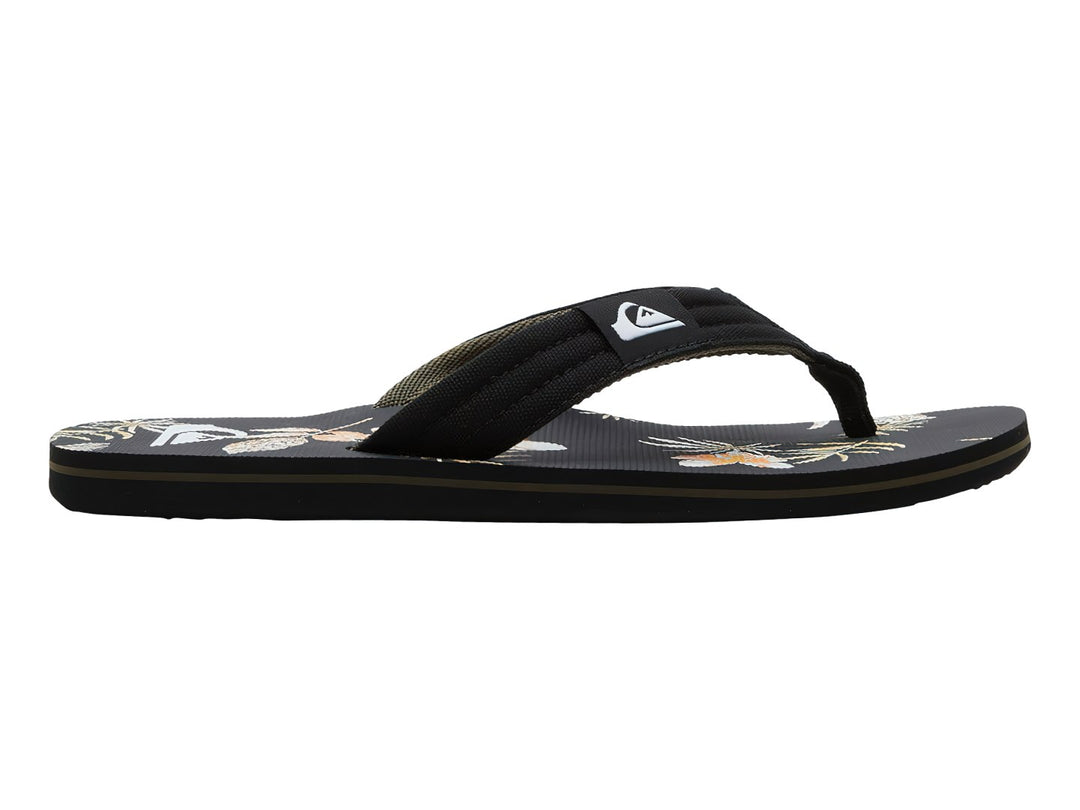 Sandalias Quiksilver negras con estampado tropical en la plantilla y correa negra.