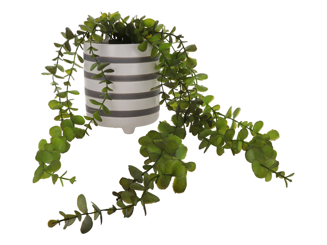 Planta artificial verde en maceta cilíndrica de dolomita con rayas blancas y grises.