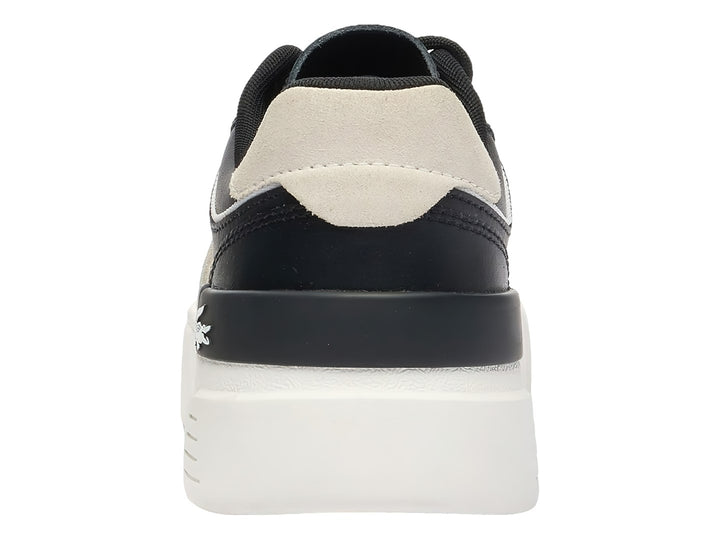 Tenis Lacoste color negro con detalles en blanco roto y suela de plataforma blanca.